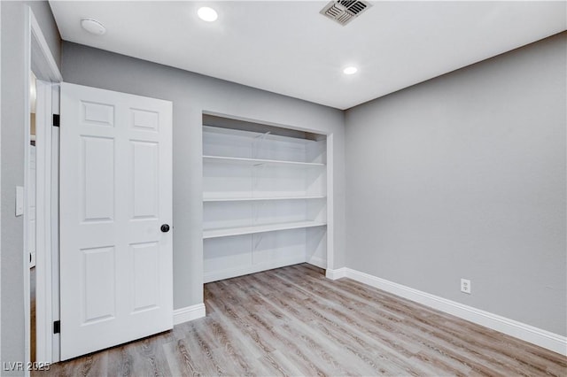 3971 Foxboro Cir, Las Vegas, NV 89121 - unfurnished bedroom featuring wood finished floors, baseboards, a closet, and recessed lighting