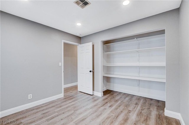 3971 Foxboro Cir, Las Vegas, NV 89121 - unfurnished bedroom featuring wood finished floors, baseboards, a closet, and recessed lighting