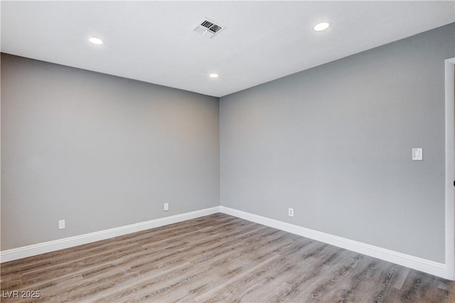 3971 Foxboro Cir, Las Vegas, NV 89121 - spare room with wood finished floors, recessed lighting, and baseboards