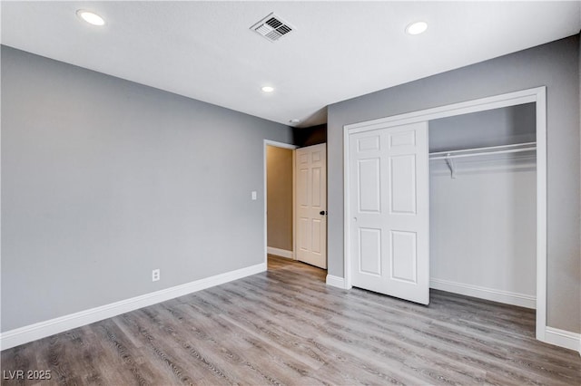 3971 Foxboro Cir, Las Vegas, NV 89121 - unfurnished bedroom with wood finished floors, baseboards, a closet, and recessed lighting