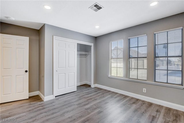3971 Foxboro Cir, Las Vegas, NV 89121 - unfurnished bedroom featuring light wood finished floors, baseboards, a closet, and recessed lighting