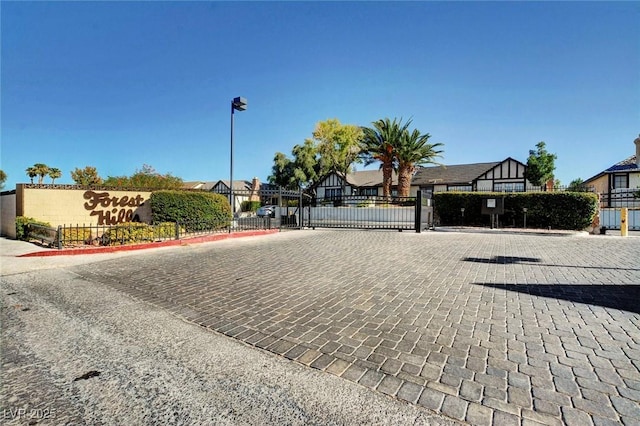 3971 Foxboro Cir, Las Vegas, NV 89121 - view of street with curbs, street lights, a gated entry, and a gate