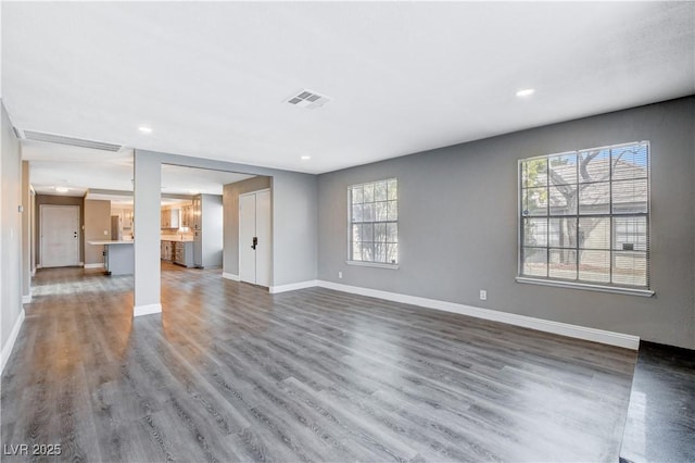 3971 Foxboro Cir, Las Vegas, NV 89121 - unfurnished living room with baseboards, wood finished floors, and recessed lighting
