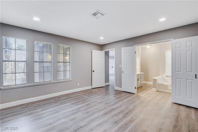 3971 Foxboro Cir, Las Vegas, NV 89121 - unfurnished bedroom featuring light wood-type flooring, baseboards, recessed lighting, and ensuite bathroom