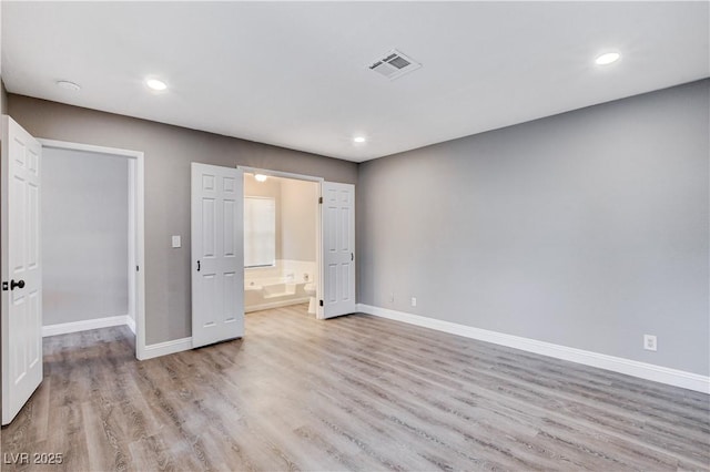3971 Foxboro Cir, Las Vegas, NV 89121 - unfurnished bedroom featuring baseboards, light wood-type flooring, recessed lighting, and ensuite bath