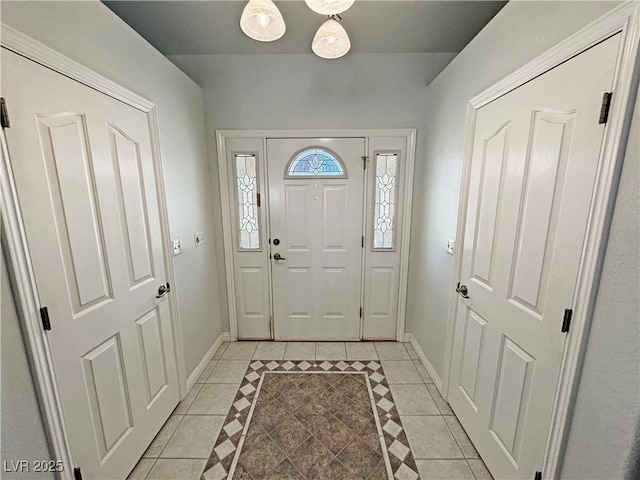 3451 Sagebrush Ave, Pahrump, NV 89048 - foyer with light tile patterned flooring and baseboards