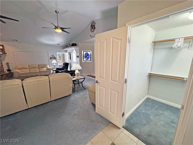3451 Sagebrush Ave, Pahrump, NV 89048 - living room with a ceiling fan, carpet flooring, lofted ceiling, tile patterned flooring, and baseboards