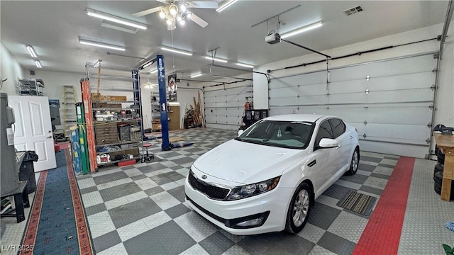 3451 Sagebrush Ave, Pahrump, NV 89048 - garage with a garage door opener and a ceiling fan