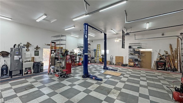 3451 Sagebrush Ave, Pahrump, NV 89048 - garage featuring a garage door opener and electric water heater