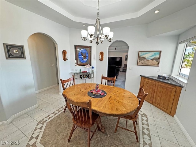 3451 Sagebrush Ave, Pahrump, NV 89048 - dining space featuring arched walkways, light tile patterned floors, baseboards, a chandelier, and recessed lighting
