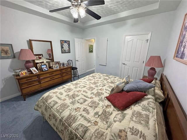 3451 Sagebrush Ave, Pahrump, NV 89048 - bedroom with a raised ceiling, carpet, baseboards, and a ceiling fan