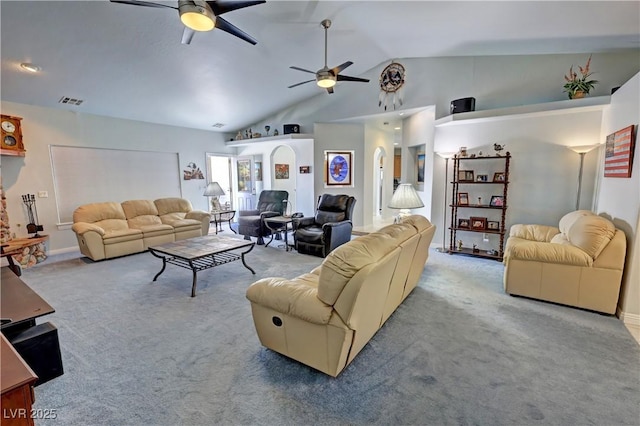 3451 Sagebrush Ave, Pahrump, NV 89048 - carpeted living area featuring a ceiling fan, vaulted ceiling, and arched walkways
