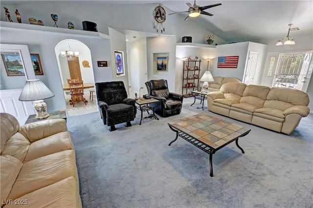 3451 Sagebrush Ave, Pahrump, NV 89048 - carpeted living area with a chandelier, a ceiling fan, high vaulted ceiling, and arched walkways