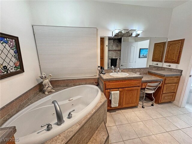 3451 Sagebrush Ave, Pahrump, NV 89048 - bathroom with a tub with jets, vanity, and tile patterned flooring