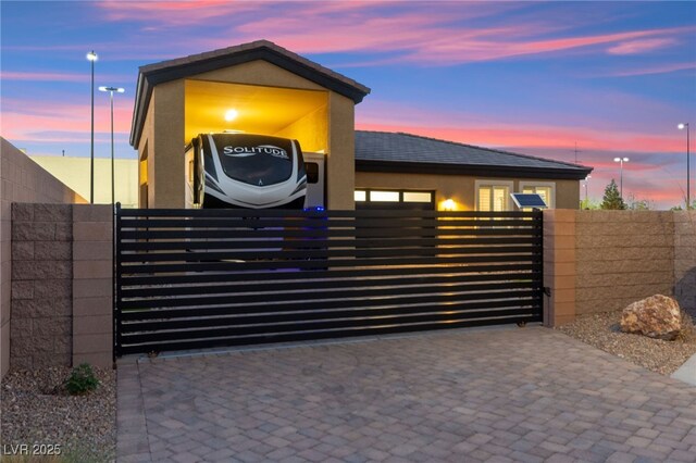 6980 W Meranto Ave, Las Vegas, NV 89178 - gate at dusk with a fenced front yard