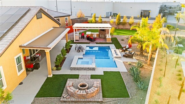 6980 W Meranto Ave, Las Vegas, NV 89178 - view of swimming pool featuring an outdoor fire pit, a patio, a lawn, and a pool with connected hot tub