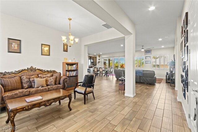 6980 W Meranto Ave, Las Vegas, NV 89178 - living area with a chandelier, light wood finished floors, recessed lighting, and a ceiling fan