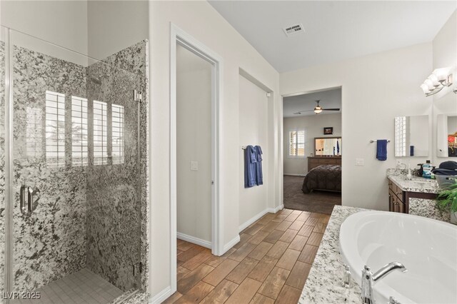 6980 W Meranto Ave, Las Vegas, NV 89178 - full bathroom featuring vanity, a shower stall, a bath, connected bathroom, and wood finished floors