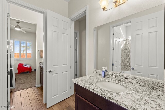 6980 W Meranto Ave, Las Vegas, NV 89178 - full bath featuring vanity, ceiling fan, wood finished floors, and a shower