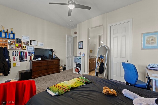 6980 W Meranto Ave, Las Vegas, NV 89178 - bedroom with connected bathroom and a ceiling fan
