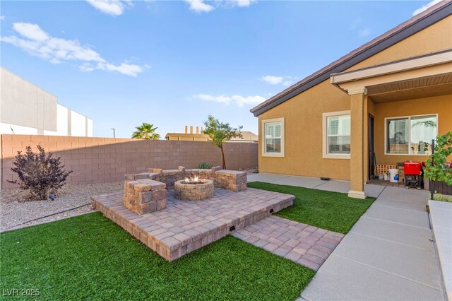 6980 W Meranto Ave, Las Vegas, NV 89178 - fenced backyard with a fire pit and a patio
