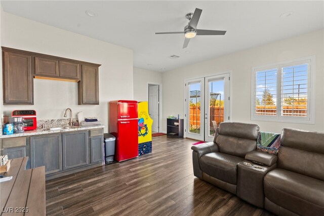 6980 W Meranto Ave, Las Vegas, NV 89178 - living room with dark wood finished floors and ceiling fan