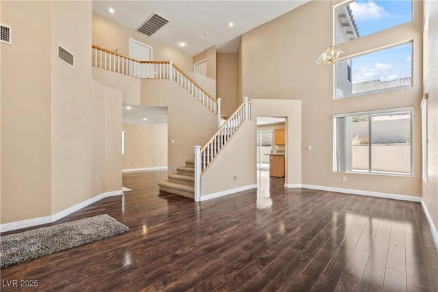 5 Spur Cross Cir, Henderson, NV 89012 - entrance foyer featuring hardwood / wood-style floors, baseboards, stairway, a high ceiling, and a chandelier