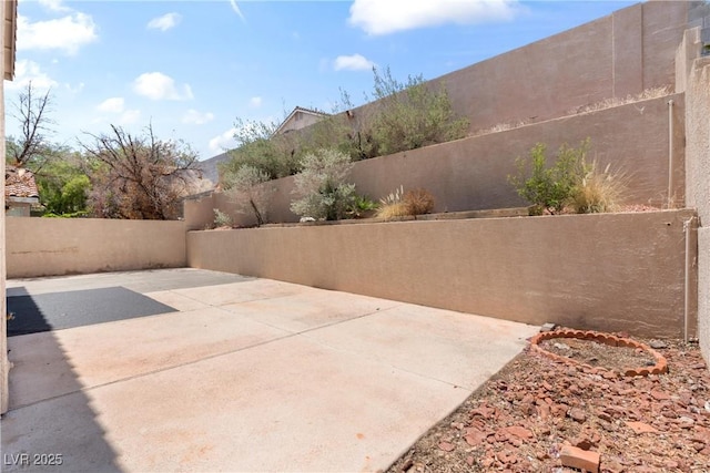5 Spur Cross Cir, Henderson, NV 89012 - fenced backyard featuring a patio area
