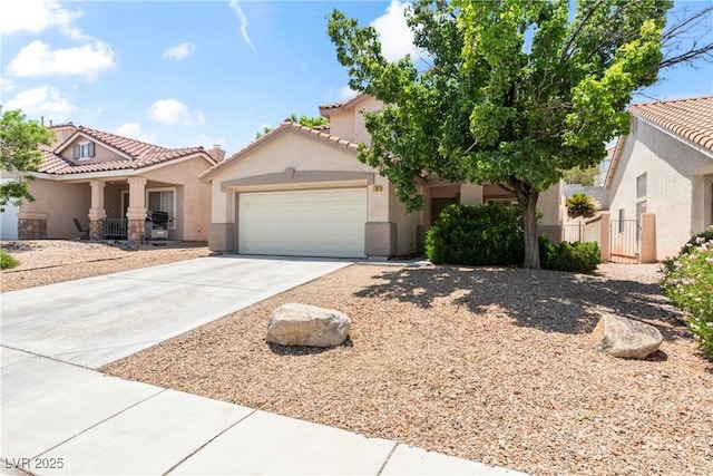 5 Spur Cross Cir, Henderson, NV 89012 - mediterranean / spanish home featuring stucco siding, a garage, driveway, and a tile roof