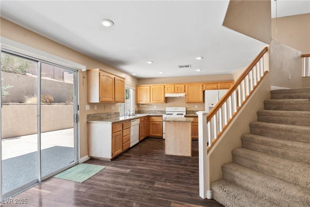 5 Spur Cross Cir, Henderson, NV 89012 - kitchen with white appliances, light brown cabinets, dark wood finished floors, a sink, and recessed lighting