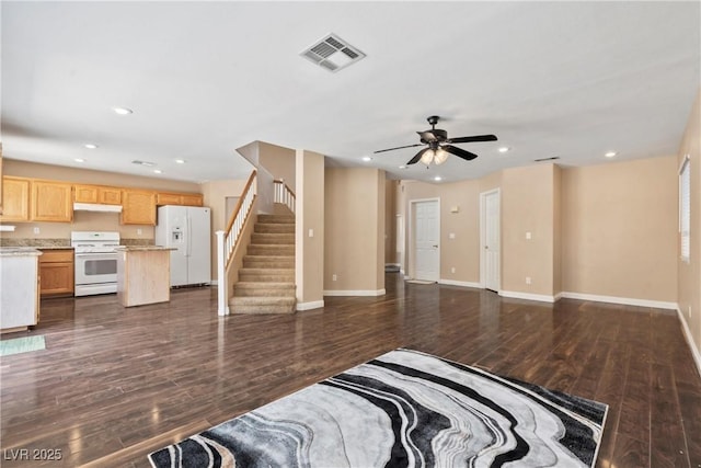 5 Spur Cross Cir, Henderson, NV 89012 - unfurnished living room featuring dark wood-style flooring, recessed lighting, baseboards, ceiling fan, and stairs