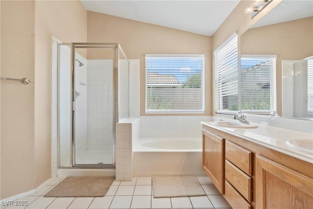5 Spur Cross Cir, Henderson, NV 89012 - full bath featuring a garden tub, a shower stall, double vanity, tile patterned floors, and vaulted ceiling