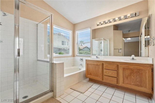 5 Spur Cross Cir, Henderson, NV 89012 - bathroom with a stall shower, a bath, double vanity, tile patterned floors, and lofted ceiling