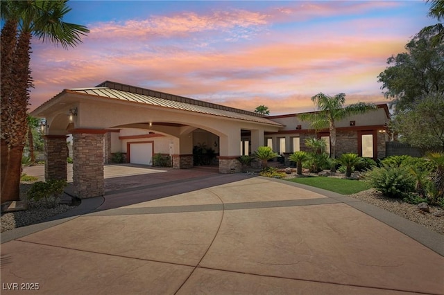 9111 W Stephen Ave, Las Vegas, NV 89149 - view of front of house with stone siding, concrete driveway, and stucco siding