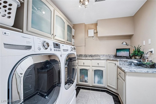 9111 W Stephen Ave, Las Vegas, NV 89149 - laundry area featuring cabinet space and washing machine and clothes dryer