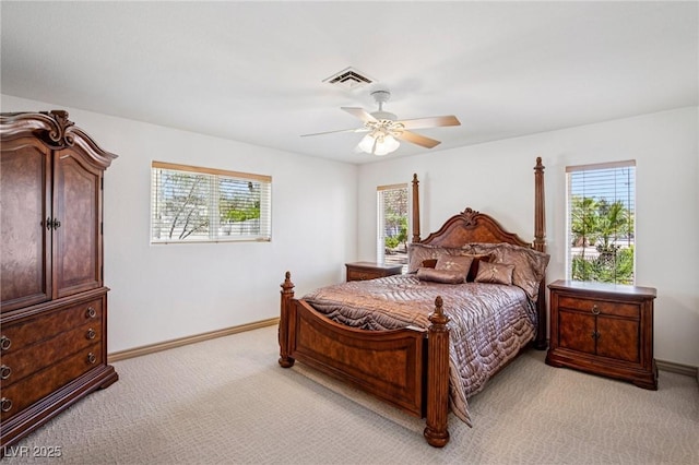 9111 W Stephen Ave, Las Vegas, NV 89149 - bedroom with light carpet, multiple windows, and baseboards