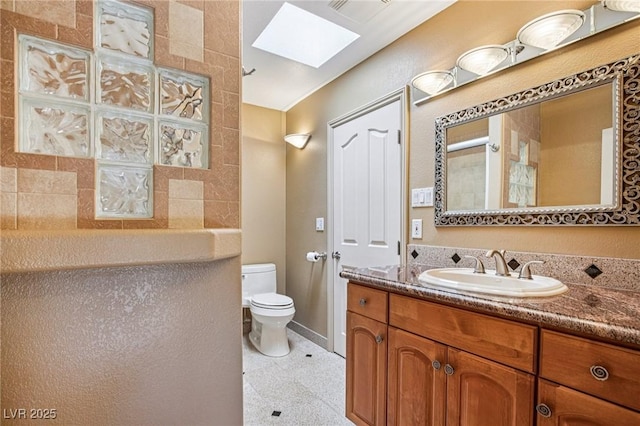 9111 W Stephen Ave, Las Vegas, NV 89149 - full bathroom with a skylight, vanity, toilet, baseboards, and a shower