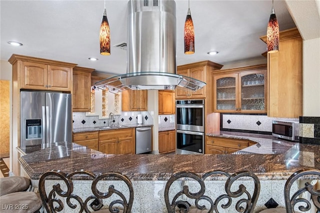9111 W Stephen Ave, Las Vegas, NV 89149 - kitchen with stainless steel appliances, island exhaust hood, a sink, dark stone counters, and recessed lighting