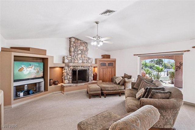 9111 W Stephen Ave, Las Vegas, NV 89149 - living area featuring carpet floors, a ceiling fan, vaulted ceiling, and a stone fireplace