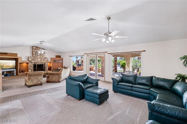 9111 W Stephen Ave, Las Vegas, NV 89149 - living area featuring a ceiling fan, carpet flooring, lofted ceiling, and a stone fireplace