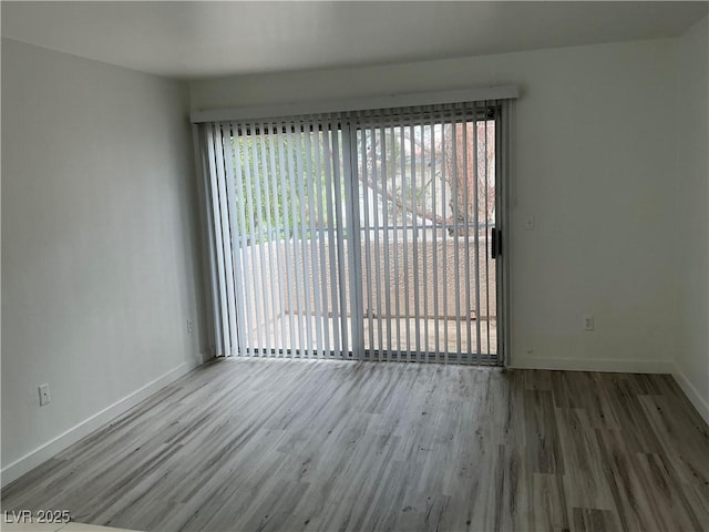 5222 Mandalay Springs Dr Unit 202, Las Vegas, NV 89120 - empty room featuring wood finished floors and baseboards