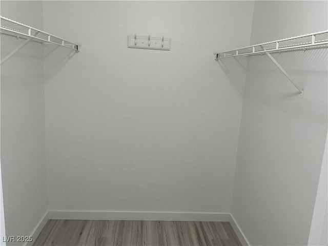 5222 Mandalay Springs Dr Unit 202, Las Vegas, NV 89120 - spacious closet with wood finished floors