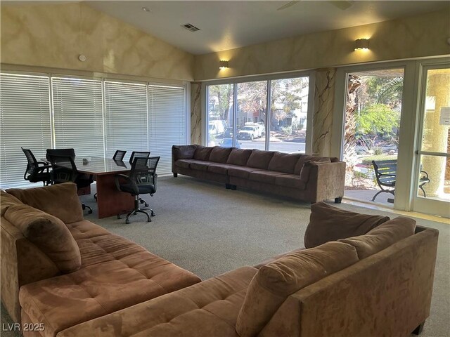 5222 Mandalay Springs Dr Unit 202, Las Vegas, NV 89120 - carpeted living area featuring healthy amount of natural light and vaulted ceiling