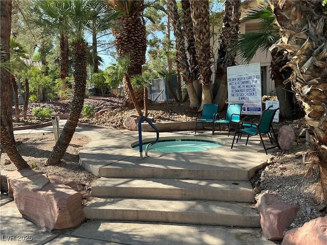 5222 Mandalay Springs Dr Unit 202, Las Vegas, NV 89120 - view of patio / terrace with a community hot tub