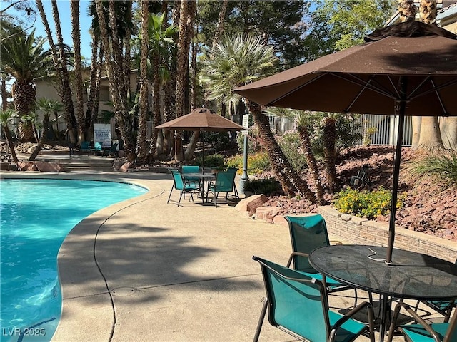 5222 Mandalay Springs Dr Unit 202, Las Vegas, NV 89120 - outdoor pool with a patio area and outdoor dining area