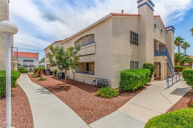 2725 S Nellis Blvd Unit 2168, Las Vegas, NV 89121 - view of building exterior with stairway and central AC