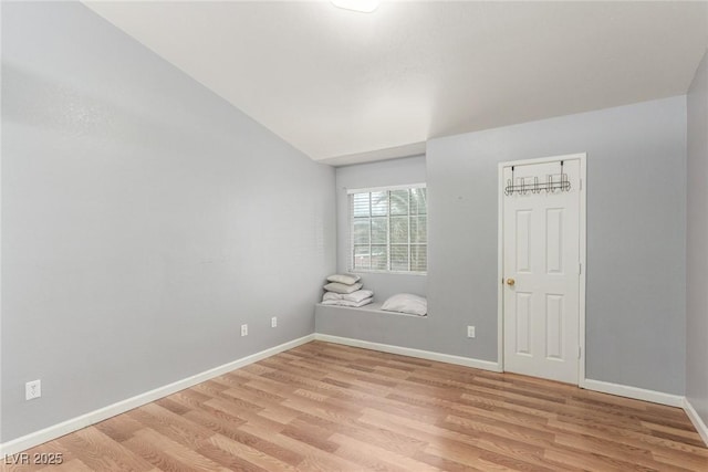 2725 S Nellis Blvd Unit 2168, Las Vegas, NV 89121 - empty room featuring light wood-style floors, baseboards, and lofted ceiling