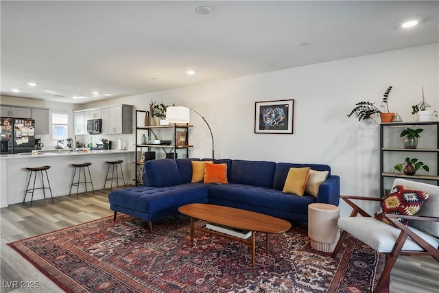 3880 Enchanted Sky St, Las Vegas, NV 89129 - living room with light wood-style flooring and recessed lighting