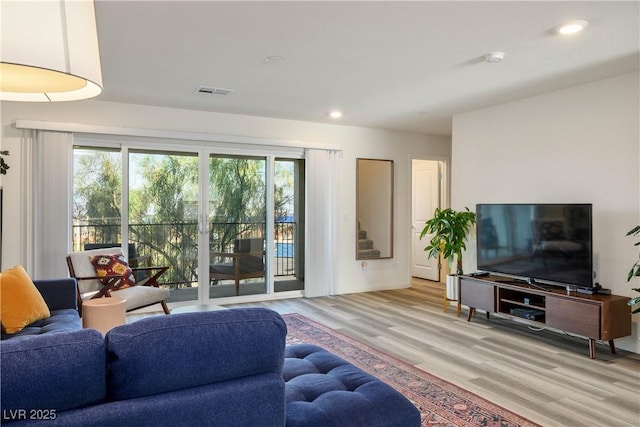 3880 Enchanted Sky St, Las Vegas, NV 89129 - living room featuring plenty of natural light, wood finished floors, and recessed lighting