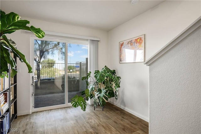 3880 Enchanted Sky St, Las Vegas, NV 89129 - entryway with baseboards and wood finished floors